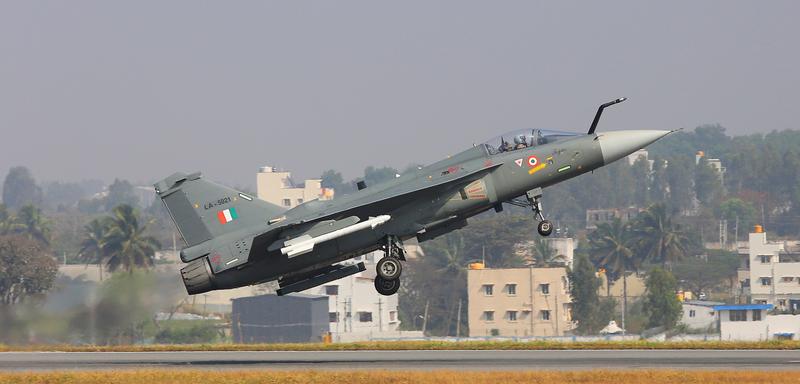 Tejas Mk1A lifting off the runway at Yelahanka with its landing gear down