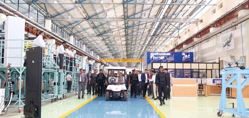 Officials walking through the Tejas Mk1A assembly hall at HAL Nashik