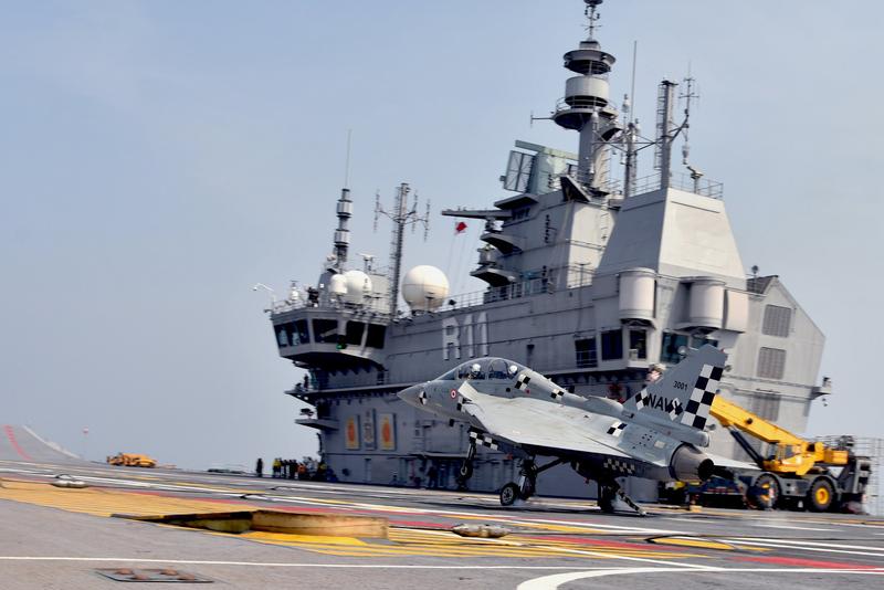 Naval Tejas on the flight deck of INS Vikrant in front of the carrier’s island