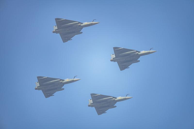 Four Tejas in diamond formation against a blue sky