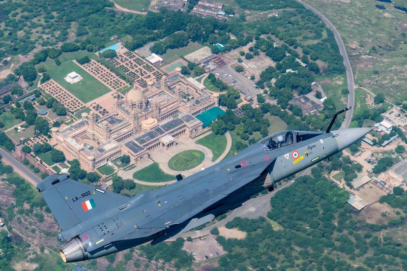 Tejas LA-5022 flying over a palace and gardens in Jodhpur